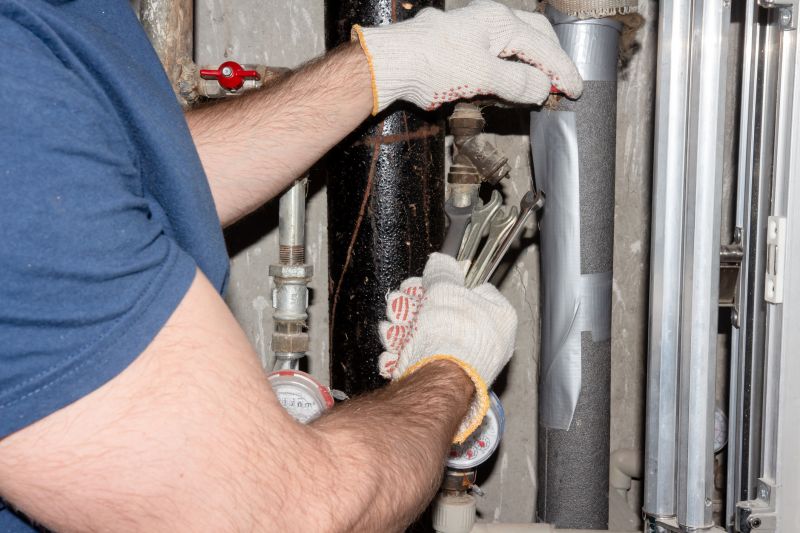 Plumber Fixing a Pipe